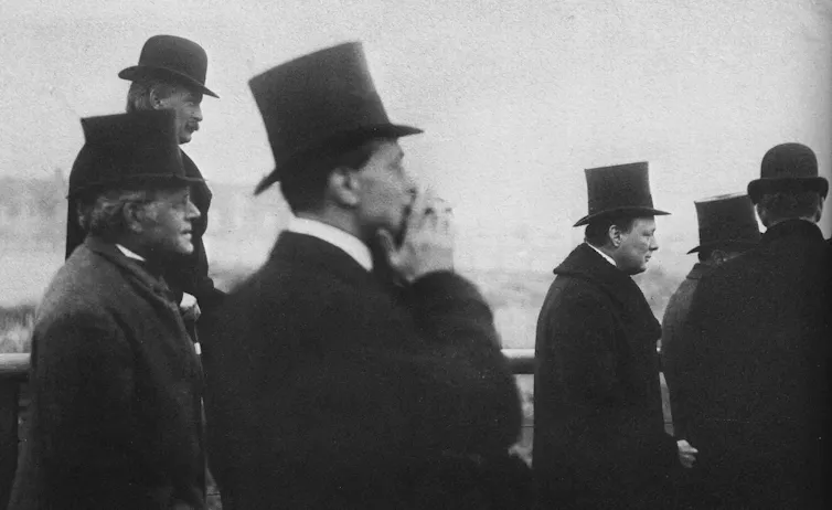 A group of men in top hats including politicians David Lloyd George and Winston Churchill