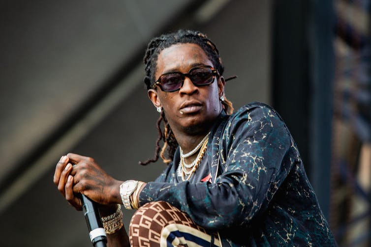 Young Thug performs on stage.