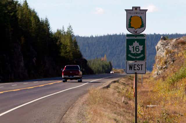 A sign next to a highway that reads: Yellowhead, Trans Canada 16 West