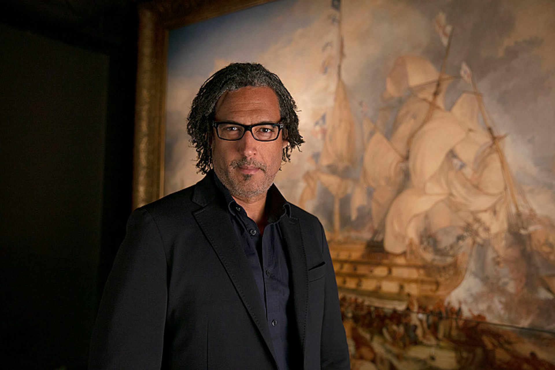 David Olusoga in front of Turner's Battle of Trafalgar