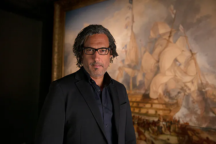 David Olusoga in front of Turner's Battle of Trafalgar