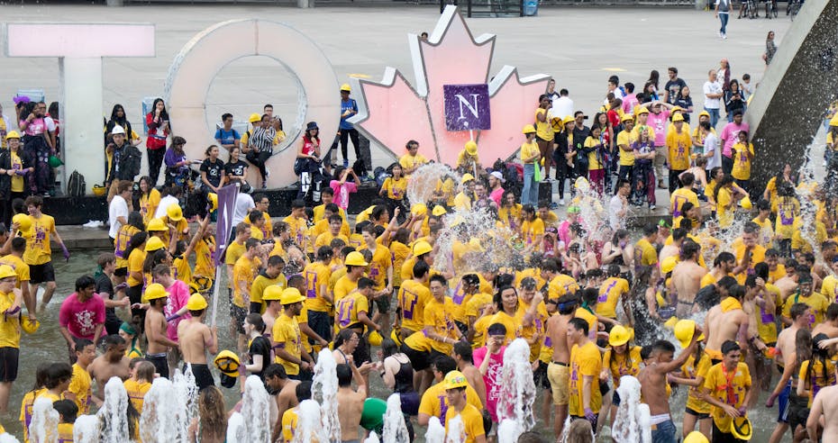 a crowd of people wearing yellow T-shirts