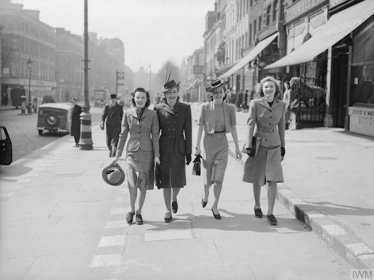 Four women walk down the street during the second world war