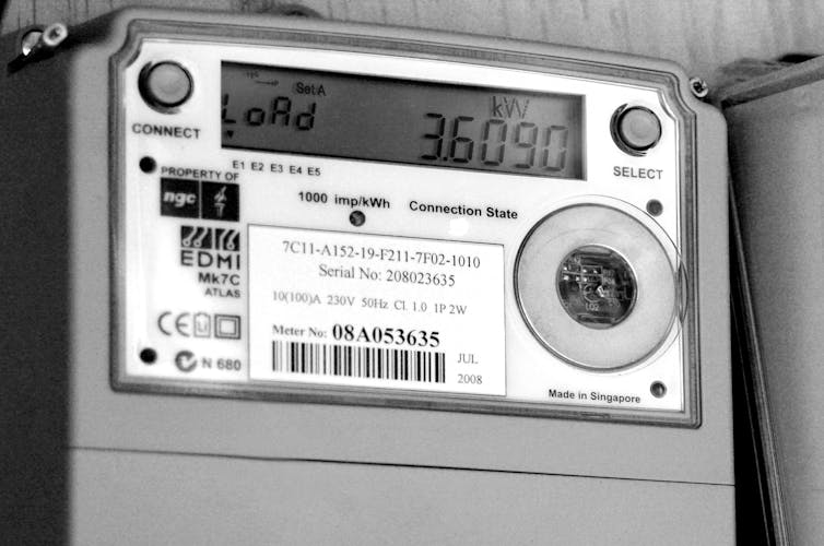 A smart electricity meter mounted on a wall