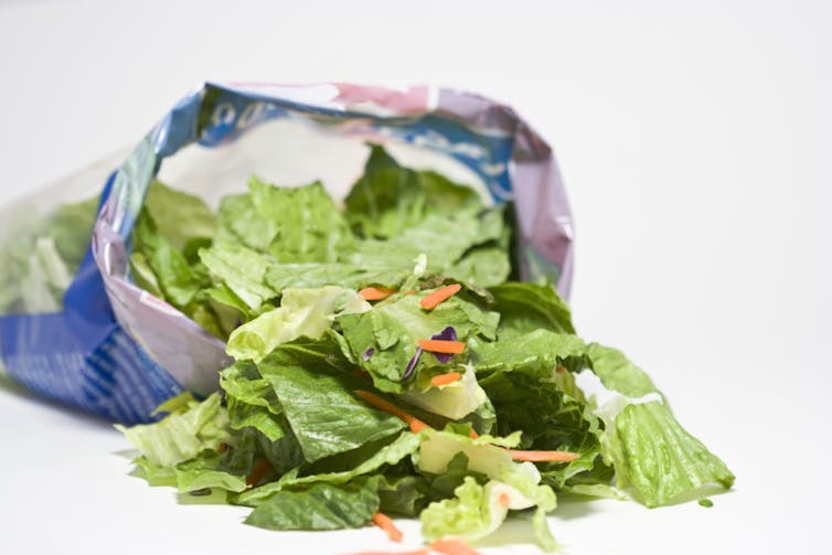 An open bag of lettuce.