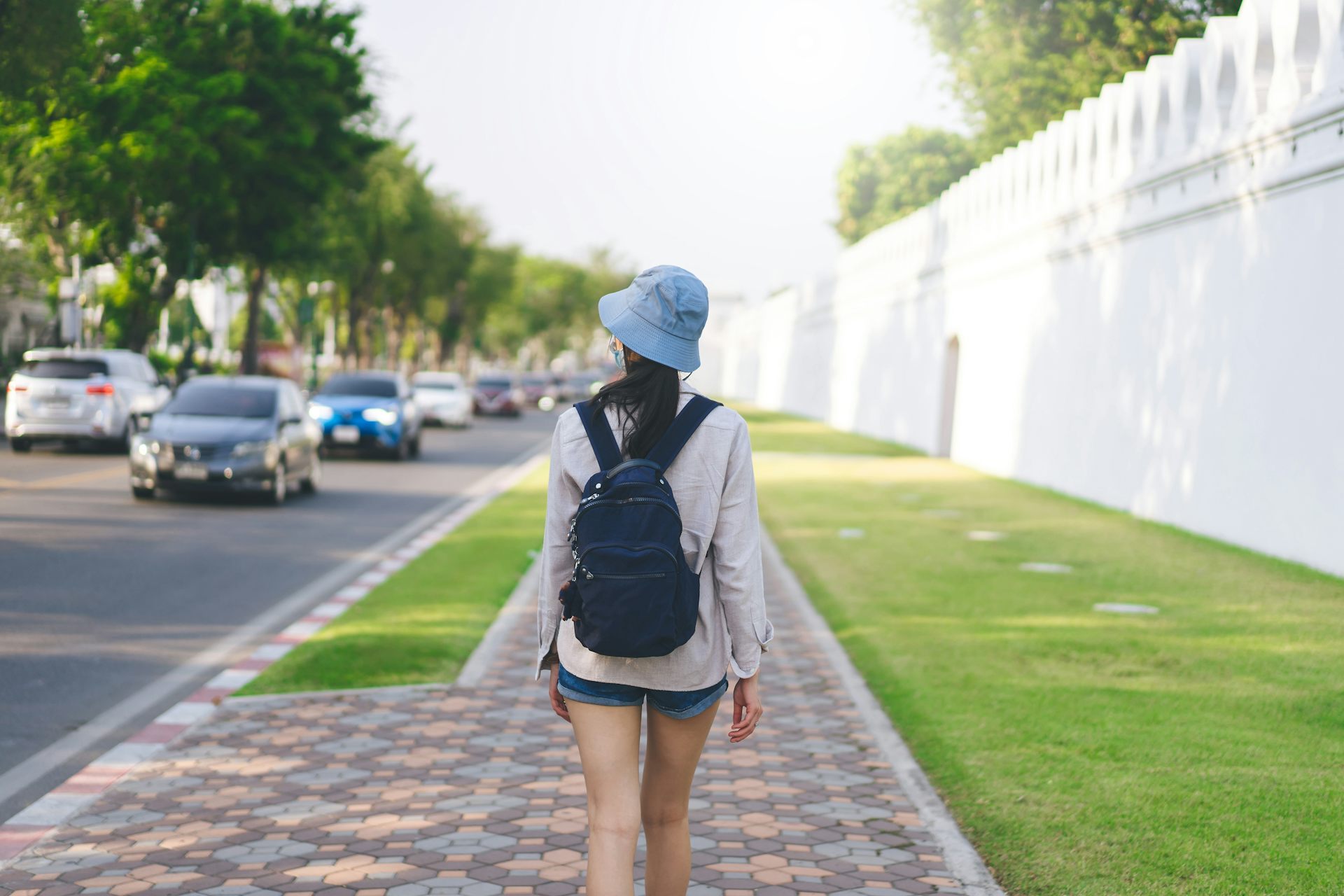 Girl holding outlet backpack