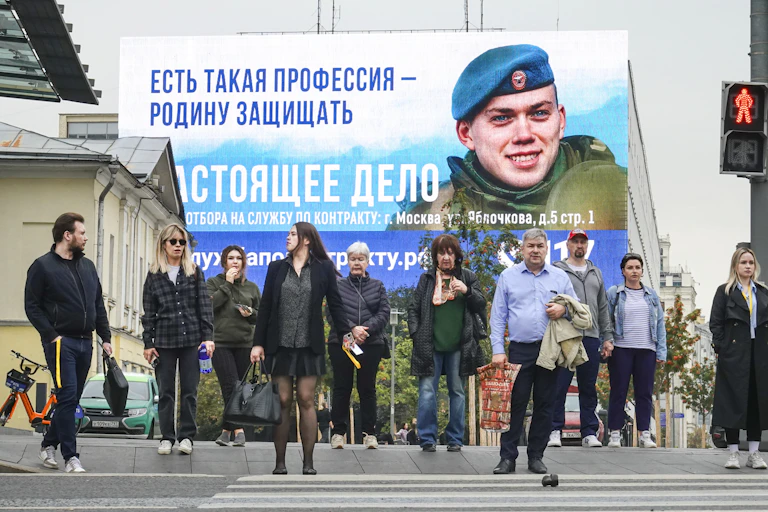 A billboard in Moscow reads: 'There is such a profession to defend the Fatherland'