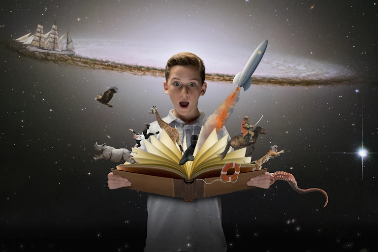 A rocket ship, an eagle and other creatures emerge from the pages of an open book being held by a boy..
