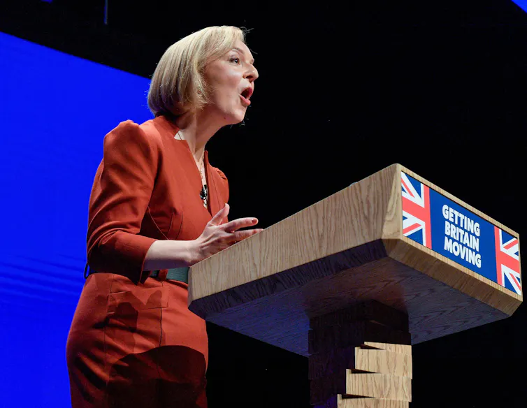 Liz Truss speaking at a lecturn at the Conservative party conference.