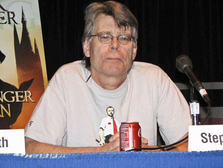 Stephen King sits on panel.