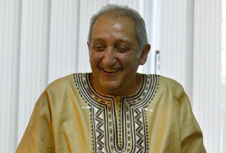 A smiling man wearing a dashiki