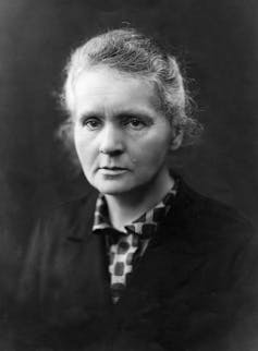 A black and white photograph portrait of a woman.