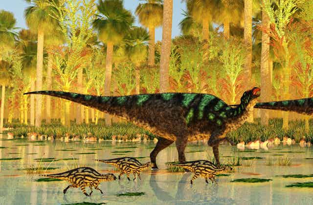 Illustration showing two adult dinosaurs and three babies running across a swamp