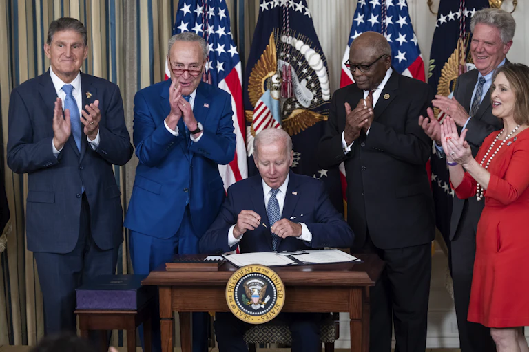 President Joe Biden signs the Inflation Reduction Act