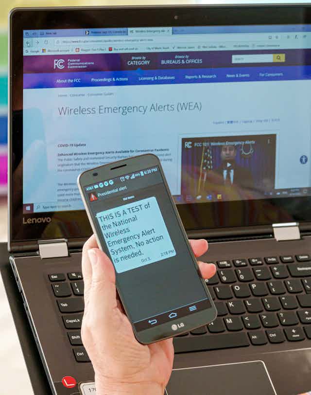 a smartphone screen displays an alert