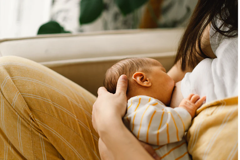 A baby being breastfed.