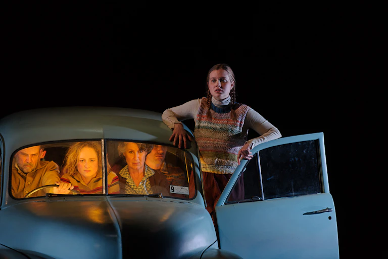 A 1960s family in a car