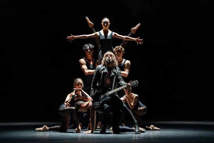 Dancers forming a human pyramid.