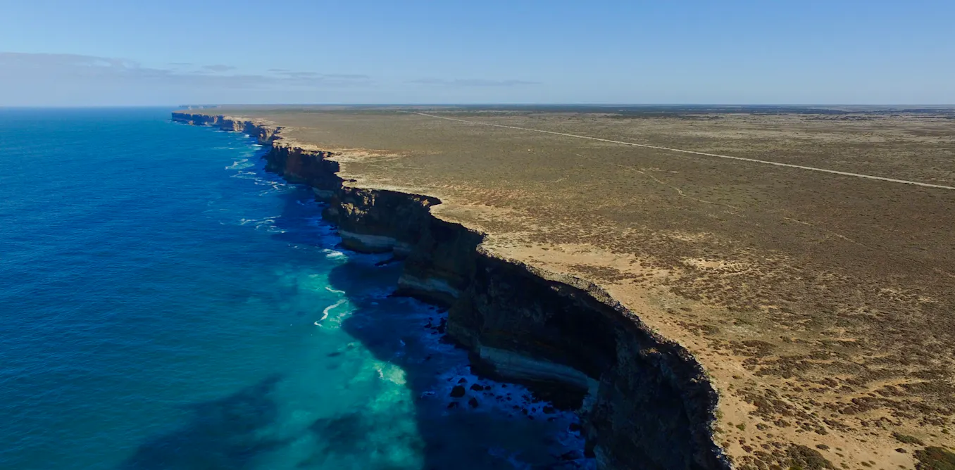 Photograph accompanying Geophysics traces the Nullarbor's faint surface trenches to caves collapsing upward