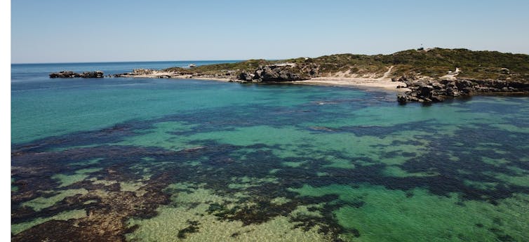 A photo of Perth's shoalwater islands marine park. Image shows shallow waters, land and sand