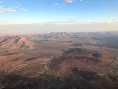 A dry, mountainous landscape seen from above.