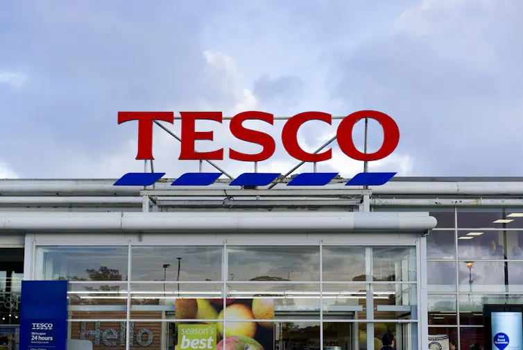 Tesco supermarket sign outside of a store.