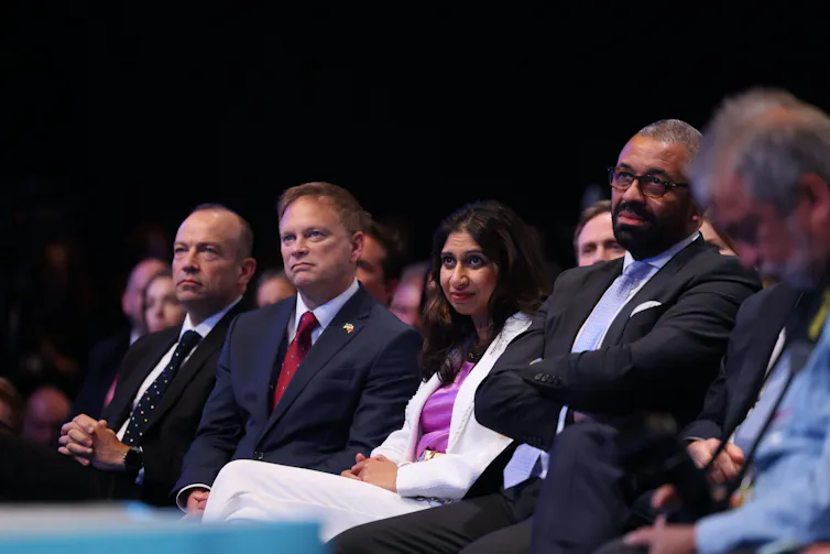Cabinet ministers sitting in a row in the audience.