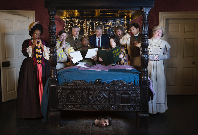 The cast of ghosts gathered round a bed