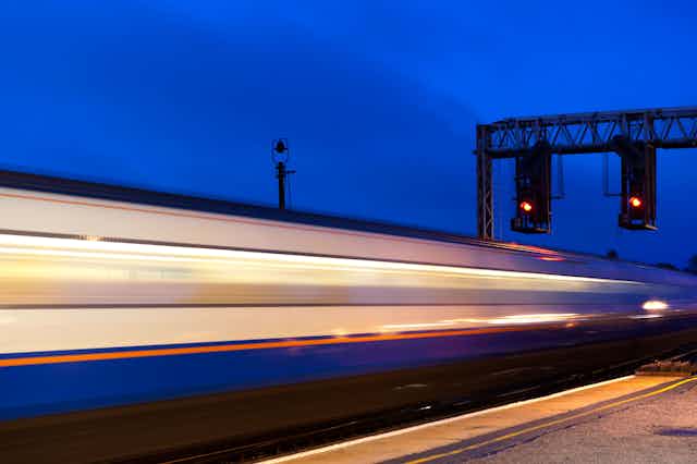 A train passing at high speed through a station