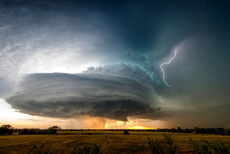 Disc shaped storm with lightning.