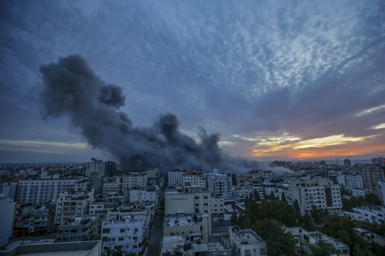 Smoke rises from a city.