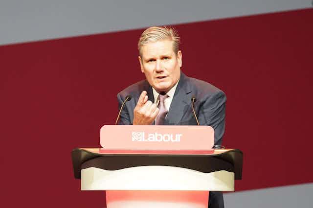 Keir Starmer speaking at a lecturn