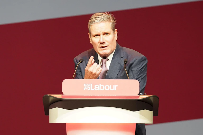 Keir Starmer speaking at a lecturn