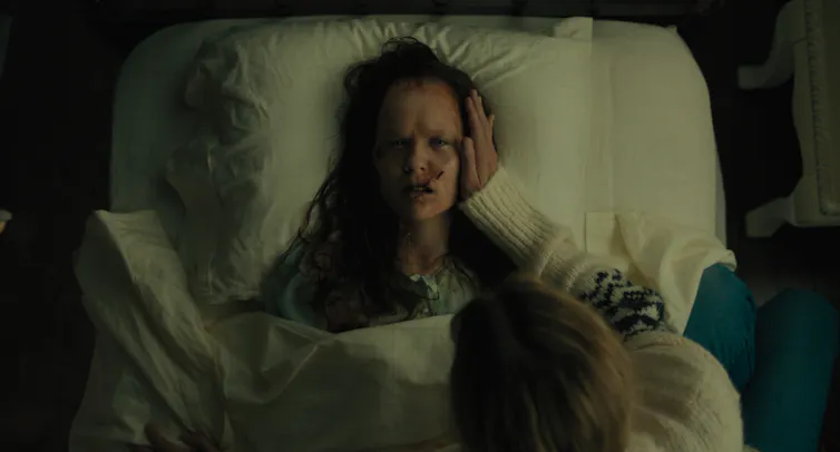 young girl lying in bed