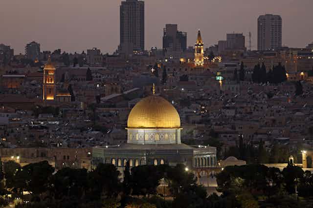 A panoramic view of Jerusalem showing all the high-rises along with the Dome of the Rock.