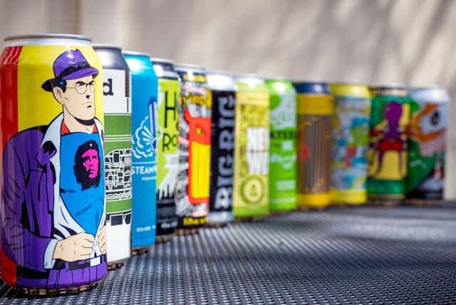 A row of colourful craft beer cans.
