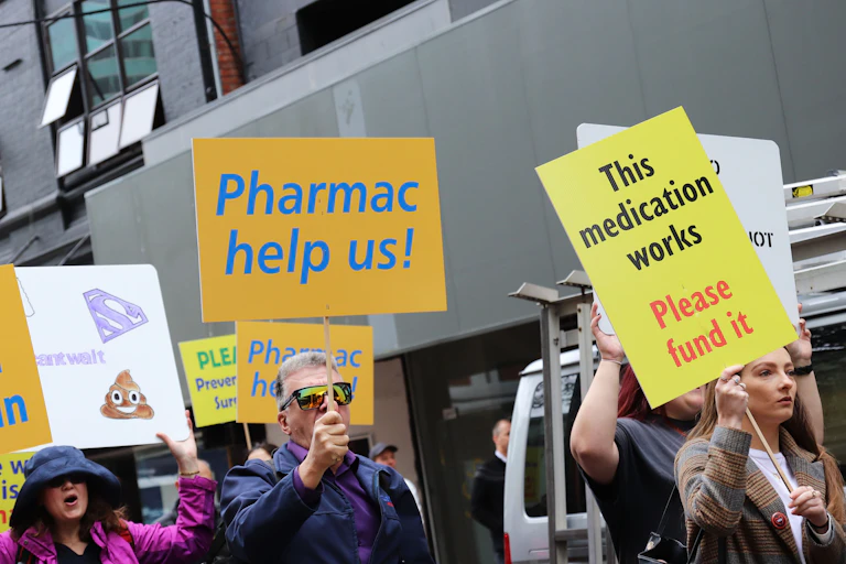 Images of a protest calling on Pharmac to fund medicines.