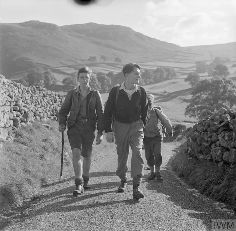 An archival photograph of young hikers.