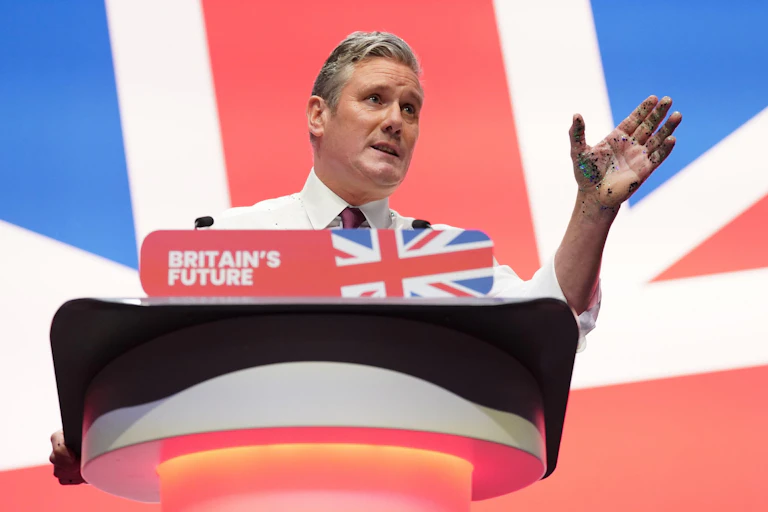 Keir Starmer speaking at a podium