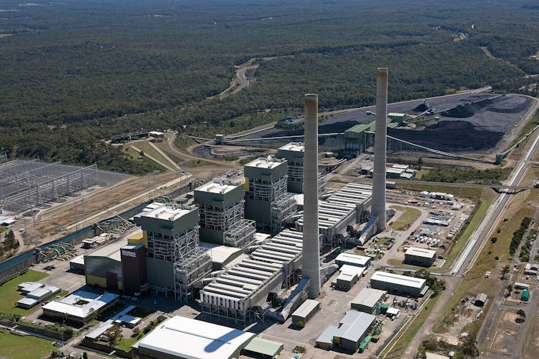Aerial view of Eraring power station next to coal mine and substation