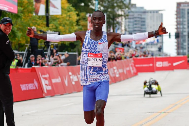 Runner on the finishing line arms outstretched