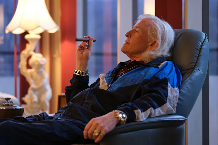 Coogan as Savile in The Reckoning smoking a cigar.