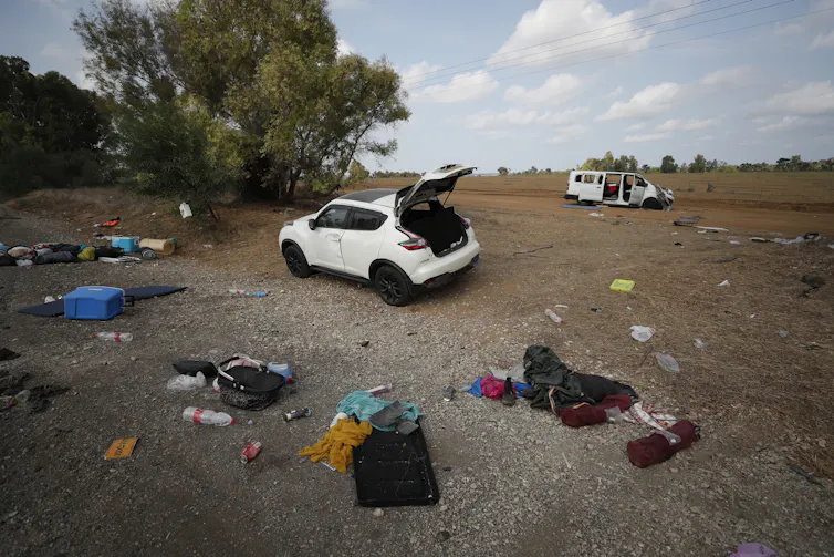 Abandoned cars and clothing in the aftermath of the Hamas attack on Supernova music festival.