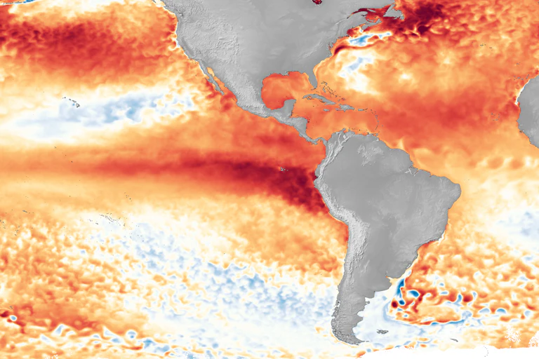 A map with a dark red streak along the equatorial Pacific, west of Ecuador, shows how monthly sea surface temperature strongly differed from long-term average (1985-1993).
