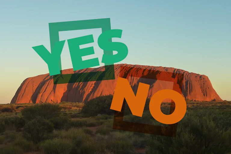 Uluru at sunset with text saying Yes and No overlayed