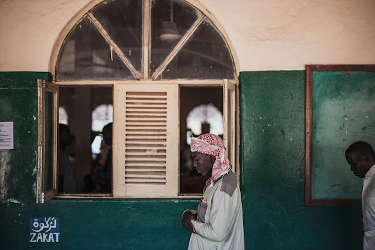 Muslim men at prayer in a mosque.