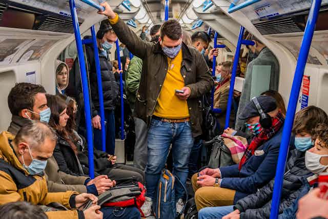 People wearing masks on London Underground