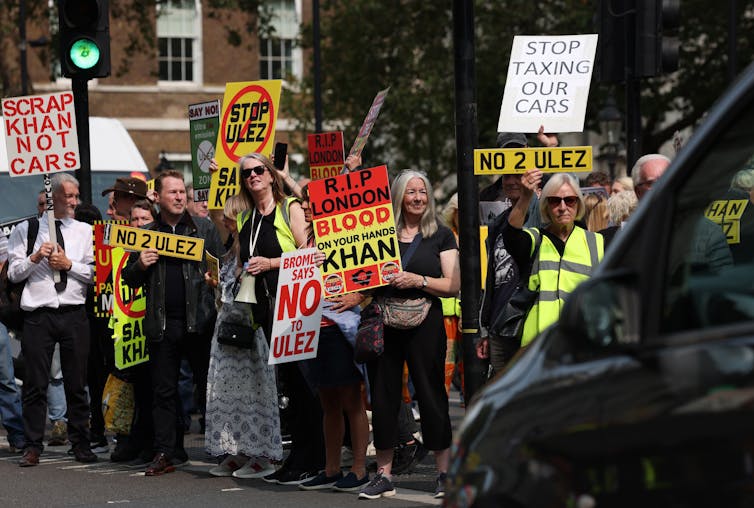 Protestors demanding an end to what they say is an unfair tax on their cars.