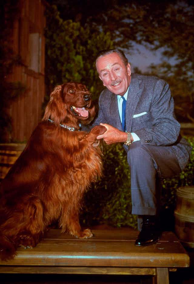 Walt Disney with a dog.