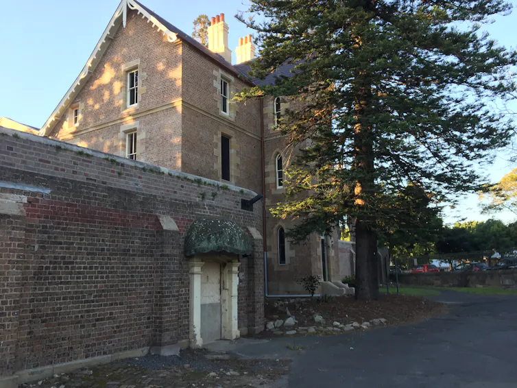 A sandstone brick building from the 1800s.